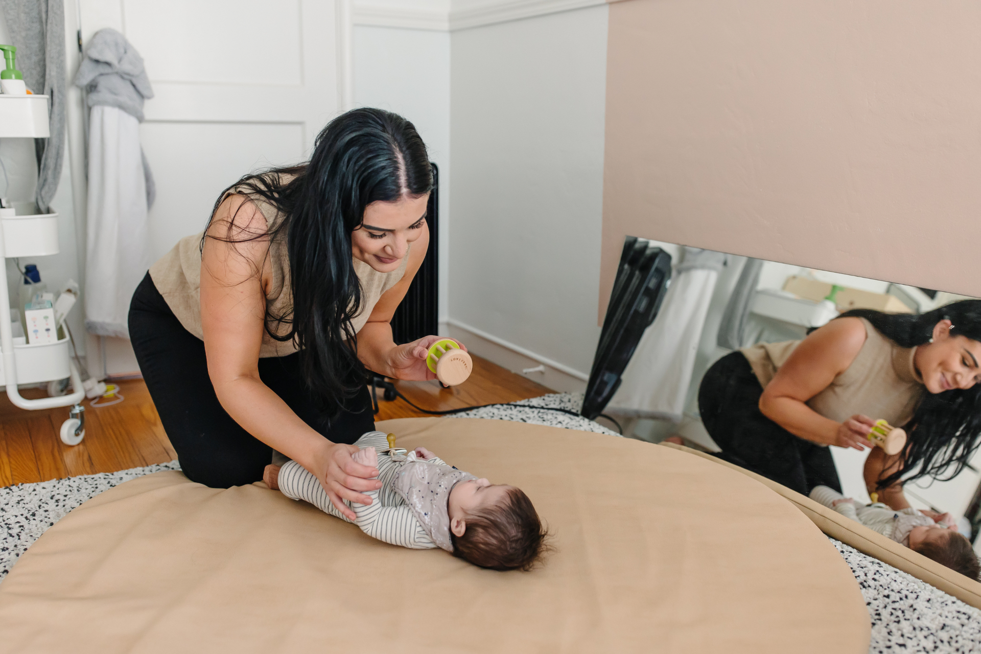 Engaging a baby with a wooden toy during developmental play